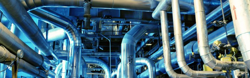 Pipes, tubes, machinery and steam turbine at a power plant